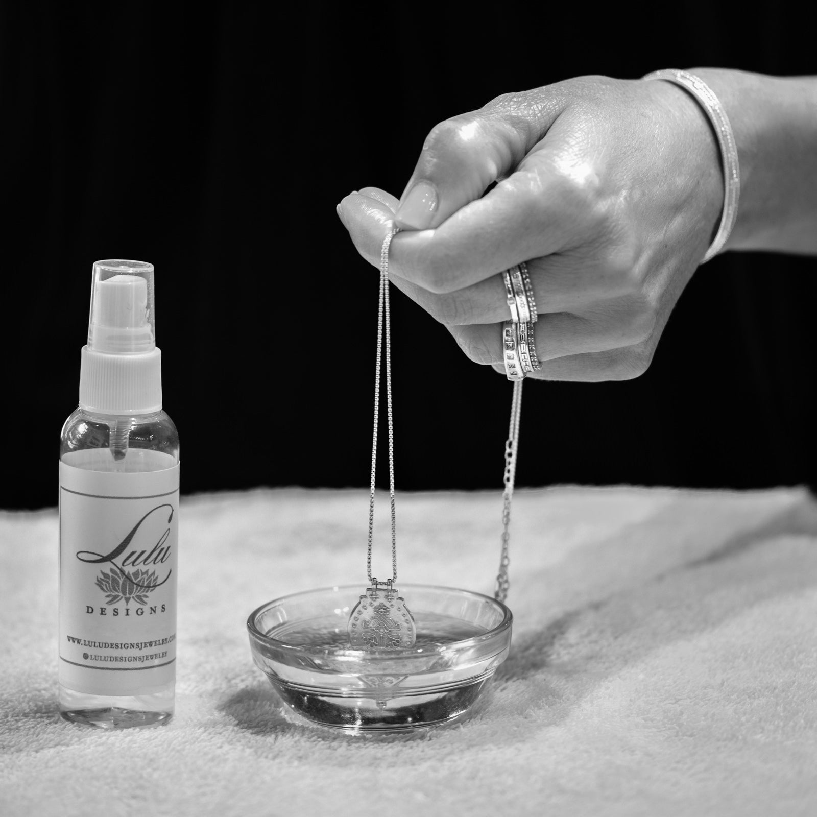 How to Help Your Forever Jewelry Last Forever Blog Post. Photo shows a necklace being cleaned by hand.